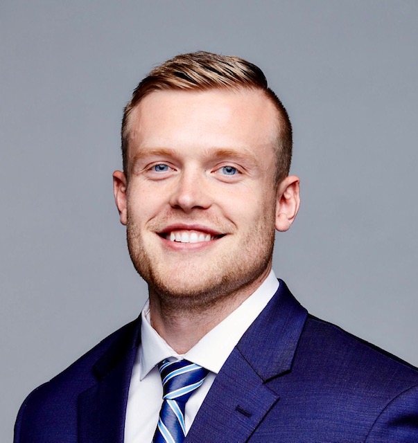 Headshot of Dr. Kosakowski in a suit and striped tie